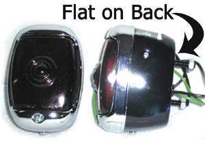 Chevrolet Car Tail Light Assembly With Script Glass Lens, Left Side. Black Housing With License Light Photo Main